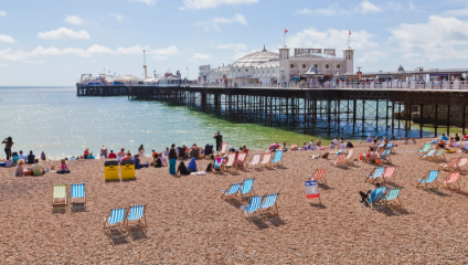 Dozens of colourful deckchairs on Brighton Beach on a sunny day