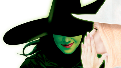 An image featuring a woman with green skin wearing a black witch hat next to a woman with a fair complexion and a white hat. The woman in white is whispering into the other woman's ear, who is smiling subtly. The background is black.