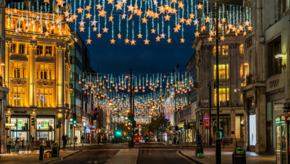 Night-time, and London’s Oxford Street is lit up by hundreds of star-shaped Christmas lights suspended above it