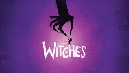A purple-toned poster for The Witches by Roald Dahl shows a giant shadowy hand clutching a small, scared person. The title The Witches is in large, white letters beneath the hand. The background gradually lightens from dark purple at the edges to lighter purple near the center.