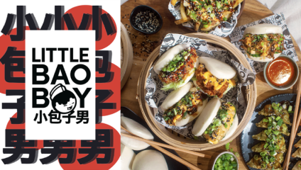 An assortment of bao buns and dumplings on a table, garnished with various toppings including green onions and sauces. A logo on the left reads LITTLE BAO BOY in English and Chinese characters with an image of a character in black and white.