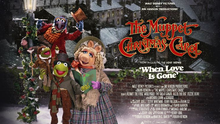 Movie poster for The Muppet Christmas Carol featuring Muppet characters Kermit the Frog, Miss Piggy, Gonzo, and Robin the Frog in Victorian-era clothing. They stand in a snow-covered town. Text includes film title and credits, promoting the inclusion of the song When Love is Gone.