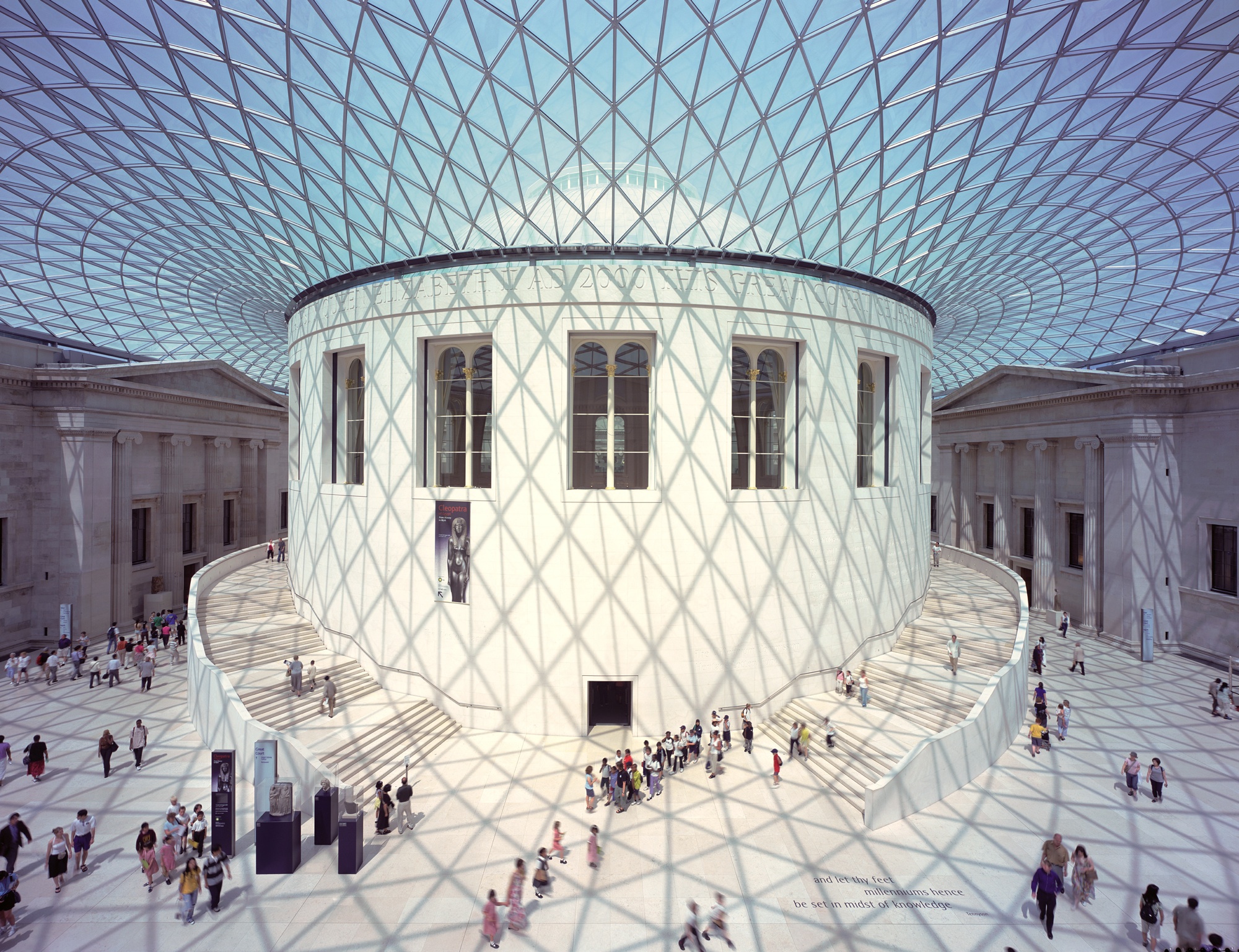 The icon interior of the British Museum in London with glass ceiling and criss crossing roof casting a distinctive shadow across the atrium.