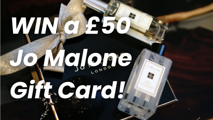 A box with a silver bow, two Jo Malone perfume bottles, and text overlay that reads WIN a £50 Jo Malone Gift Card! in bold, white letters.