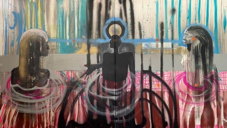 A contemporary painting features three abstract human figures. The central figure is dark with a halo around its head, extending one arm. The figures on either side are surrounded by circular bands. The background is a blend of dripping colors, primarily blue and pink.